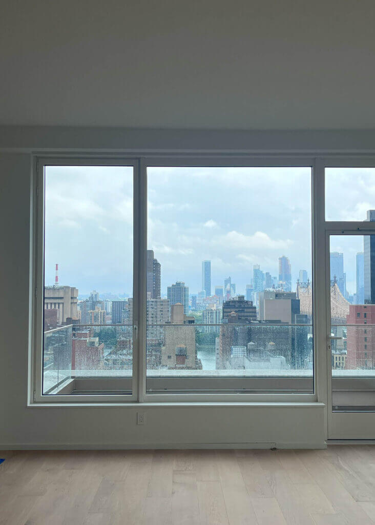 Natural oak floors and crisp white walls in a newly constructed Upper East Side apartment.