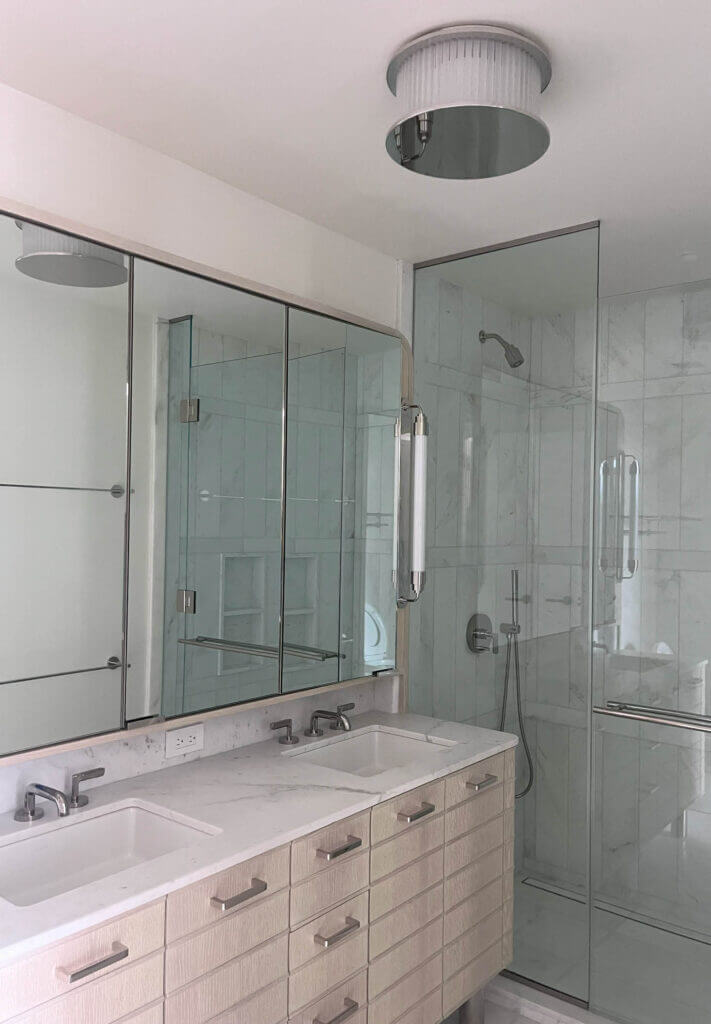 Primary bathroom design in a new construction NYC apartment by a Boston interior decorator.