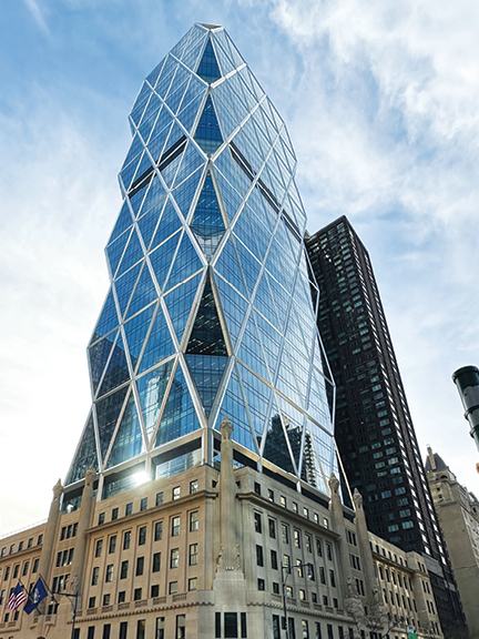 Geometric glass tower rising from a historic stone base, Hearst Tower is NYC’s first LEED-certified building.