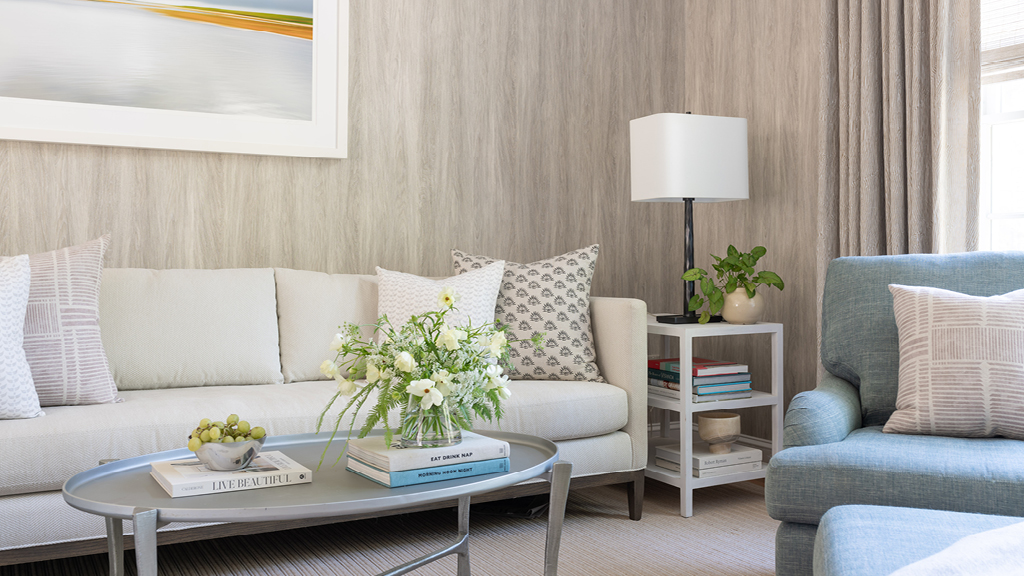 Coastal-inspired family room with light blue and neutral tones, designed by New England fabric designer Ellisha Alexina and a Hingham interior designer