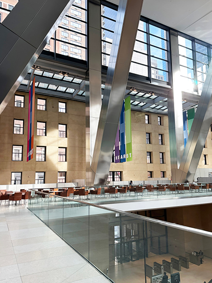 Modern atrium and lobby inside Hearst Tower NYC, a stunning space that offers NYC interior design inspiration through light and scale.
