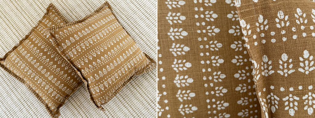 Luxury Upholstery Custom Pillows shown as a pair, using Alice Sargent Najwa floral fabric in Tobacco on a dining room bench.