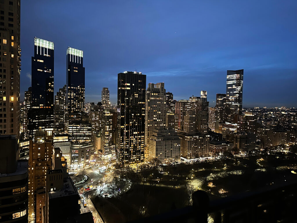 Nighttime skyline view of NYC with Central Park and Upper West Side in the distance—capturing NYC interior design inspiration after dark.