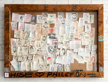 Visit Montreal in the Winter, showcasing public art with a natural wood-framed board where passersby can add their own sketches and portraits.