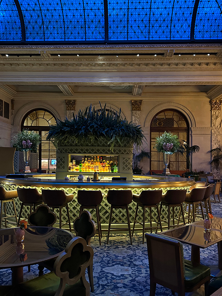 Evening glow through the Palm Court’s glass dome at Park Plaza Hotel NYC—historic elegance meets dramatic modern lighting.
