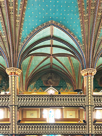 Visit Montreal in the Winter to see the teal blue ceiling with gold stars, intricate arches, and grand historic details at Notre-Dame Basilica.