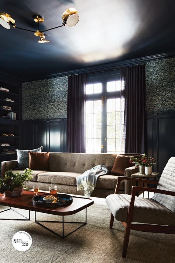 Navy family room with Lee Jofa wallpaper by Arch Digest AD PRO interior designer using mid-century furniture