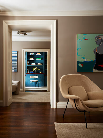 Womb Chair in primary bedroom of historic Concord home, a perfect blend of mid-century modern furniture and traditional design.