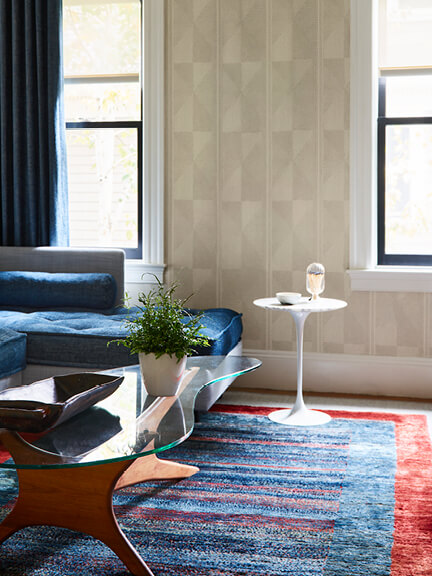 Tulip side table in a family room of a historic Brookline home featuring mid-century modern furniture
