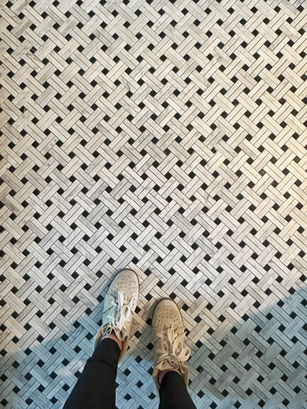 Basketweave stone tile bathroom floor in historic brownstone renovation project in Boston
