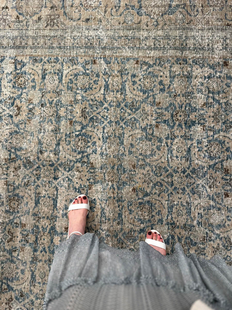 Vintage area rugs styled with Sarah Flint white block sandals in LA interior design showrooms at Ben Soleimani