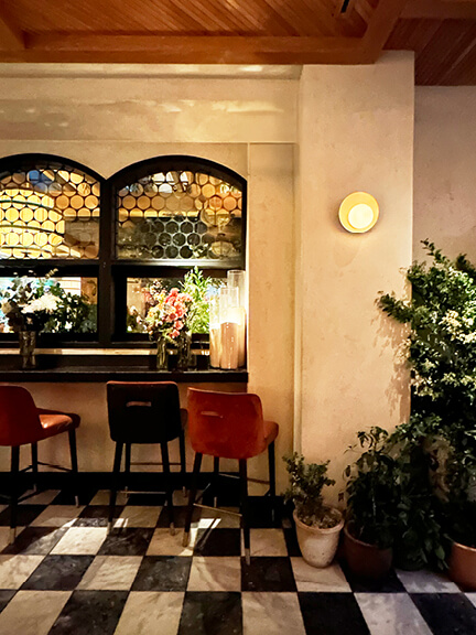 Checkerboard marble tile flooring at LAVO restaurant in Los Angeles, adding a timeless touch to the bold and modern dining space.
