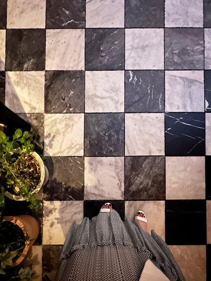 Checkerboard marble tile flooring at LAVO West Hollywood, a stylish dining spot featured in Los Angeles Shopping and Dining.