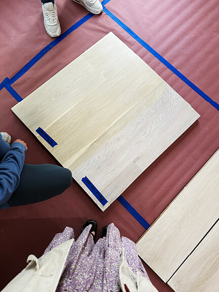 White oak floor samples laid out to test tone and finish options in a Boston brownstone interior design project