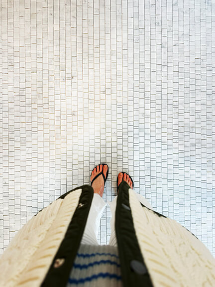 White marble flooring adds classic texture to the primary bathroom of this Boston brownstone interior design project