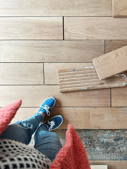 Light white oak floors add natural warmth and subtle variation to this historic Boston brownstone interior