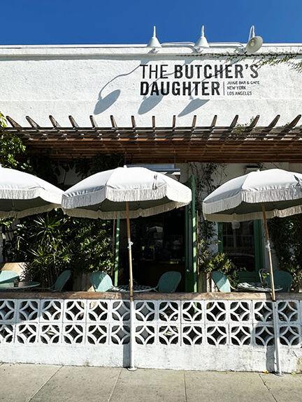 Cool restaurant exterior at The Butcher’s Daughter in West Hollywood, a standout destination for Los Angeles Shopping and Dining.