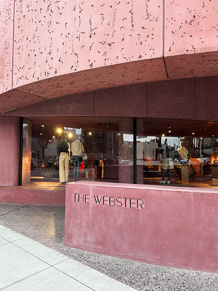 Pastel pink architecture of The Webster storefront in West Hollywood, a must-visit photo spot for Los Angeles Shopping and Dining.