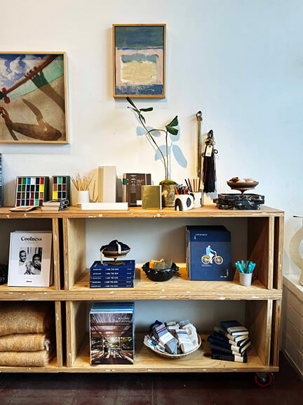 Home decor store in Los Angeles featuring modern shelving, vintage objects, and sculptural accessories in a bright, California-inspired space