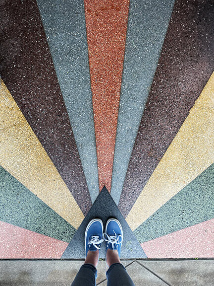 Colorful custom terrazzo flooring at the entrance of Jenna Cooper’s Los Angeles showroom, blending architecture with bold retail design style