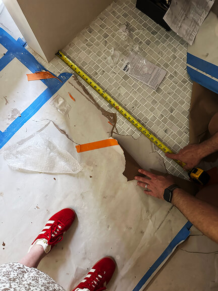 Marble mosaic tile flooring in the primary bath of a historic Boston brownstone renovation by Sarah Scales