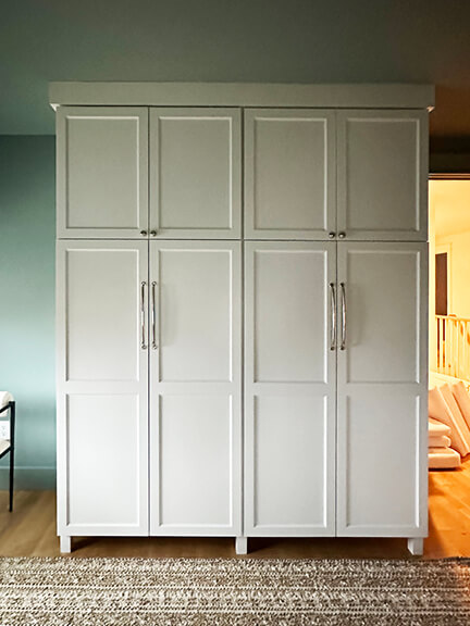 Custom built-in closet cabinets designed by a Boston interior decorator.