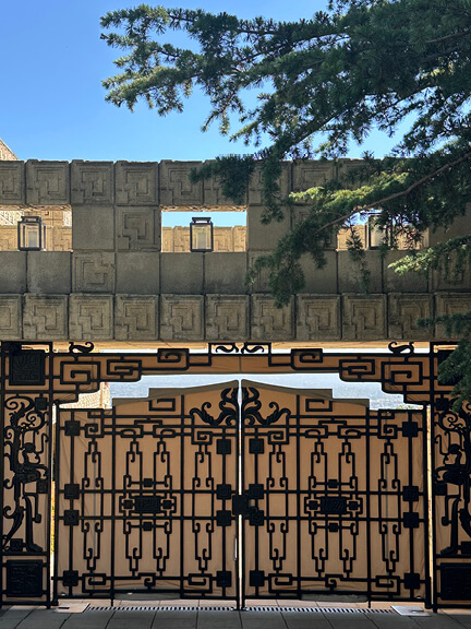 Custom metal gate with decorative ironwork at Ennis House in Los Feliz, featured on a postmodern architecture Los Angeles tour