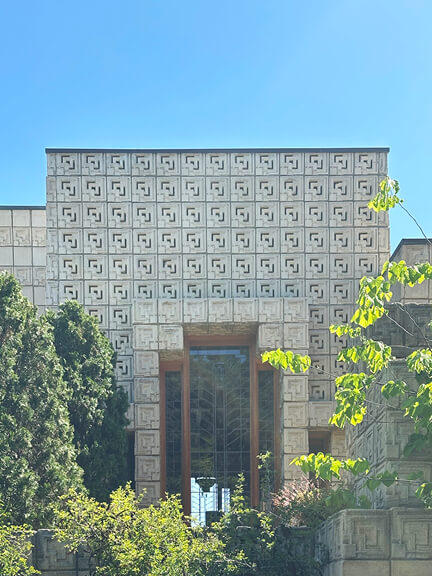 Frank Lloyd Wright’s textile block house with custom geometric windows, featured on a postmodern architecture Los Angeles tour