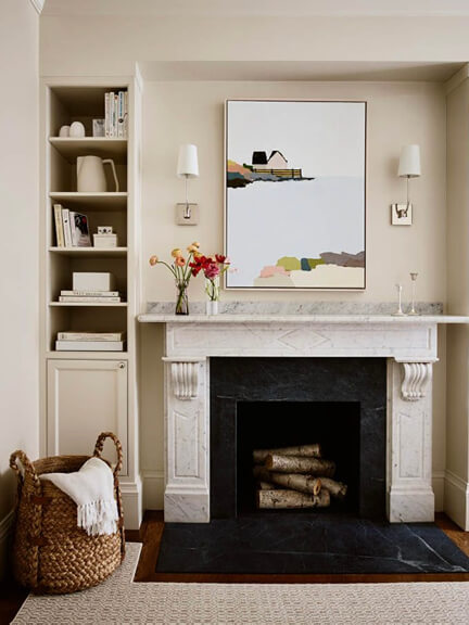 Boston brownstone interior featuring original marble fireplace and commissioned fine art by a south shore interior designer