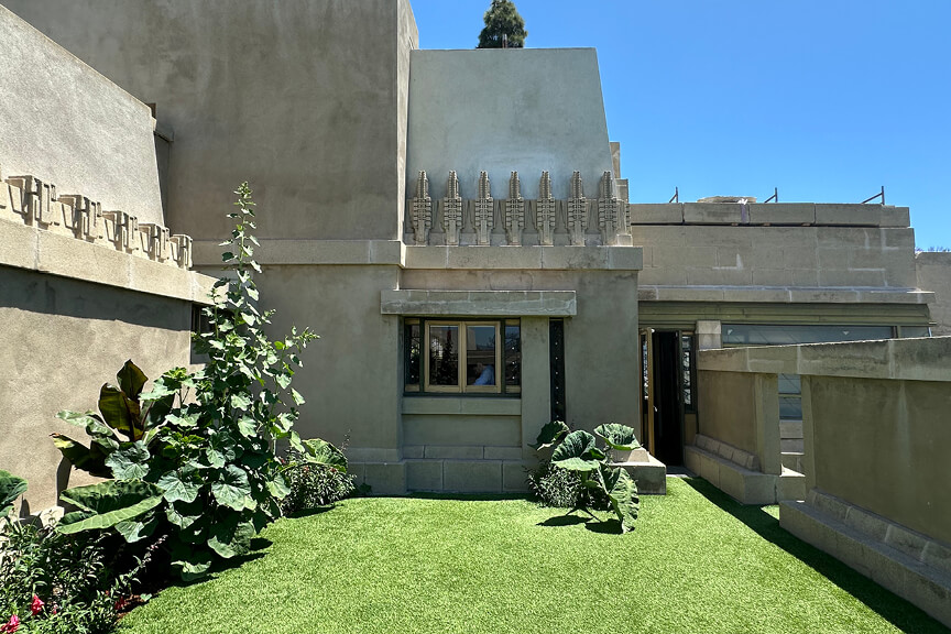 Mayan Revival concrete structure in Los Angeles with architectural details and lush landscape design at Hollyhock House