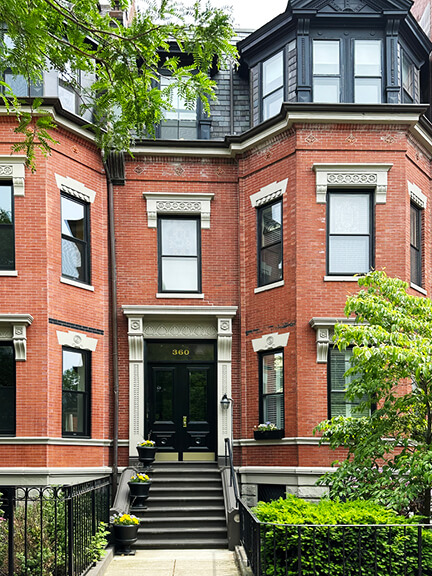 Victorian Boston townhouse with bay windows, a brick façade, and restored historic details in the heart of the Back Bay neighborhood.