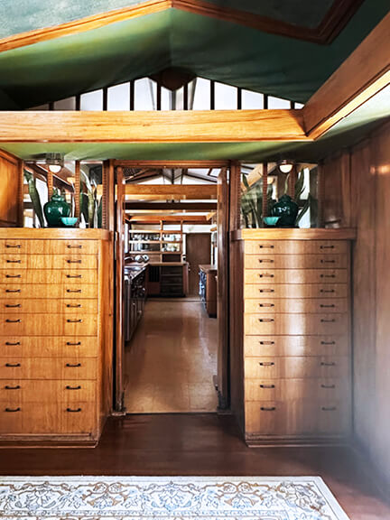 Dining room interior design with woodwork in Frank Lloyd Wright’s Hollyhock House