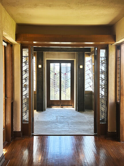 Custom geometric windows and screens at Hollyhock House, part of postmodern architecture Los Angeles tour