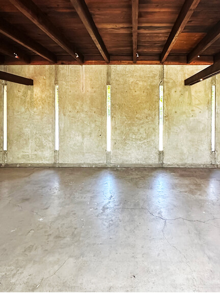 Window slots and natural wood ceilings at Schindler House highlight structural simplicity