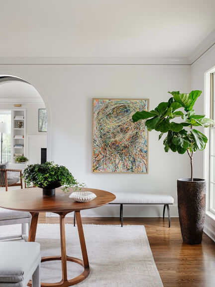 Historic Hingham home with modern furniture and contemporary art by a Hingham interior designer in a clean, renovated interior