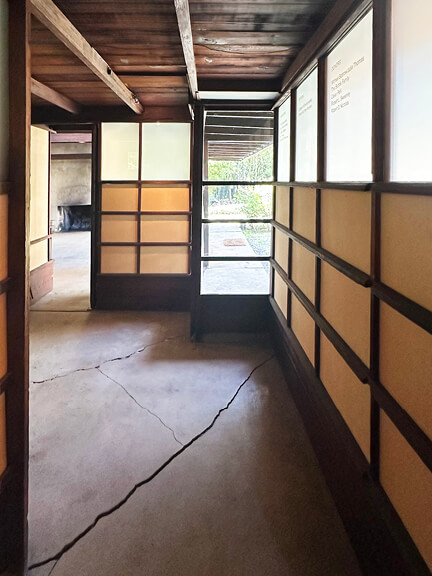 Grid pattern with glass windows and yellow panels at Schindler House, part of postmodern architecture Los Angeles tour