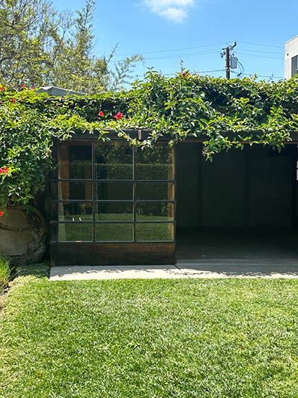 Layered window design and wood framing at Schindler House, part of postmodern architecture Los Angeles tour