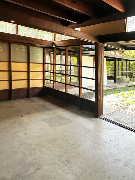 Yellow frame and glass panel window wall blurs indoor and outdoor connection at Schindler House