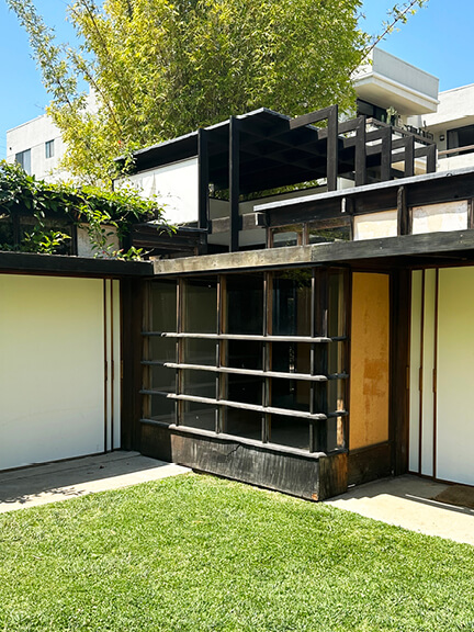Exterior view of Schindler House with rooftop sleeping quarters