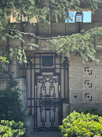 Custom door design and concrete block detailing at Ennis House, part of postmodern architecture Los Angeles tour