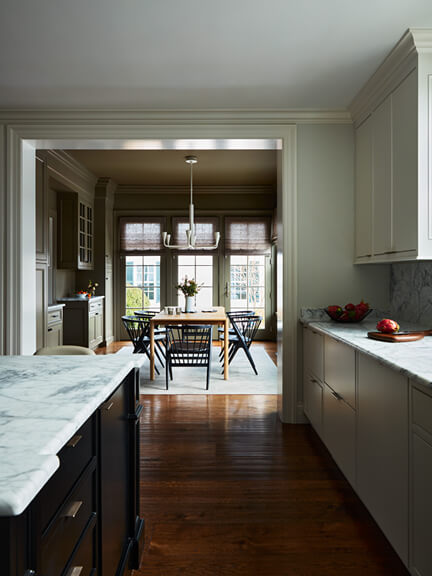 Easy Kitchen Makeover in a historic home, modern kitchen view to a dark casual dining room with Scandinavian furniture