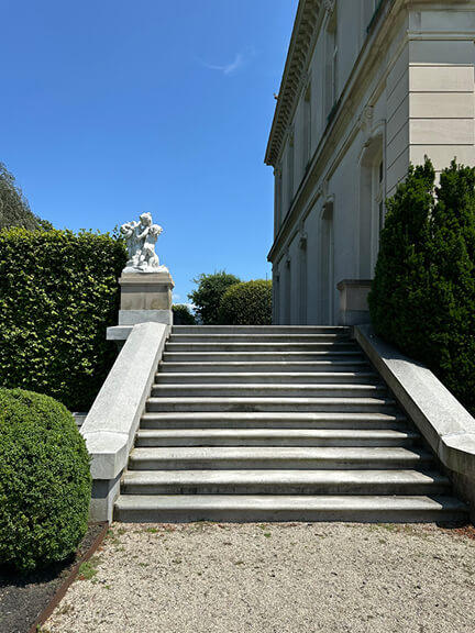 French chateau inspired architecture in New England at The Elms Newport mansion, a historic estate and filming location for HBO’s The Gilded Age.