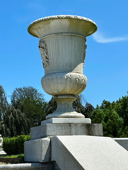 Classic French urn as a decorative stone piece in the landscape design at The Elms, filming location for HBO’s The Gilded Age in Newport.