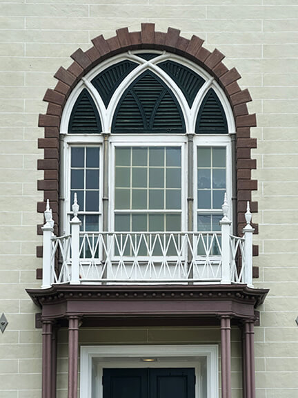 New England historic home designer captures classic Federal-style civic building with brick facade in Bristol, Rhode Island