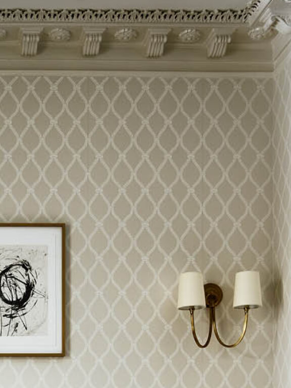 Double brass sconce chosen by Boston interior designer to create a cohesive home during the lighting selection phase