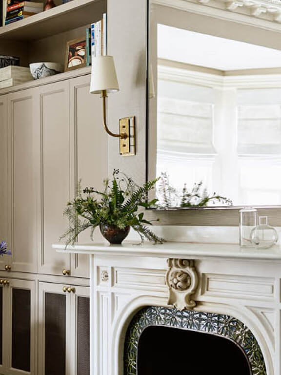 brass sconces at historic fireplace, boston brownstone interior design and renovation