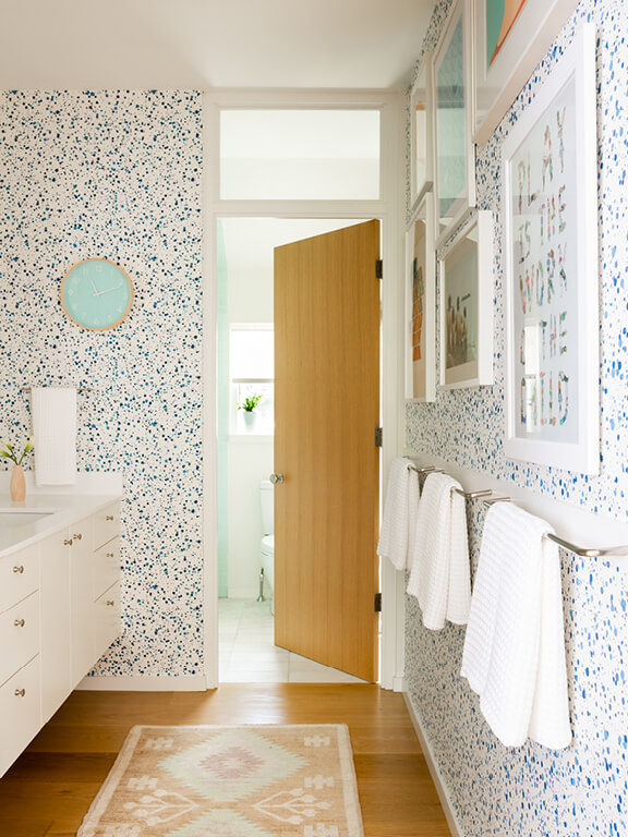 Hingham interior designer new construction home bathroom design for kids with splatter wallpaper featuring playful details chosen in design development.