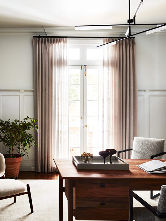 Beautiful office in a historic Boston home with traditional millwork and modern furnishings