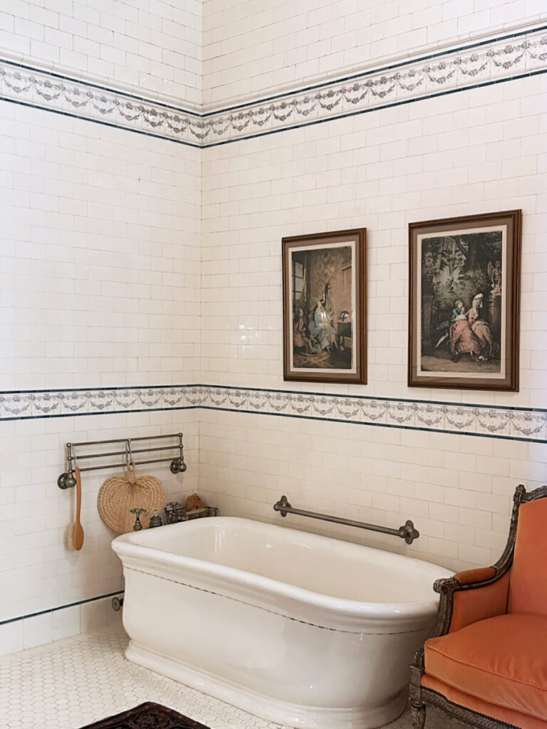 Marble tile bathroom at The Elms in Newport with blue accent tiles, a serene example of Gilded Age Interior Design refinement.