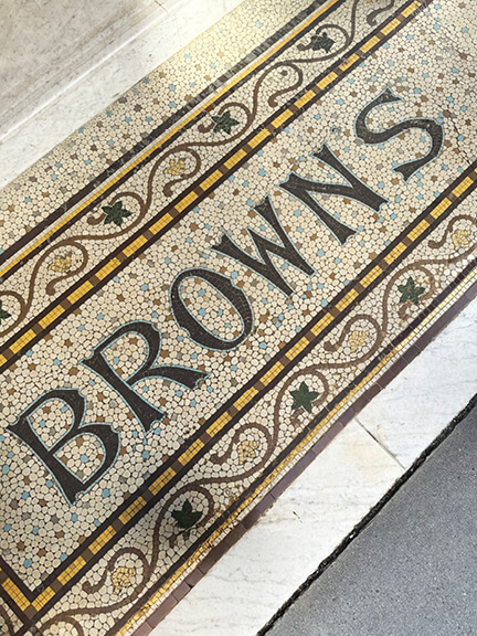 Eat sleep shop London features Browns in London with custom mosaic flooring at the entrance and traditional interior design.